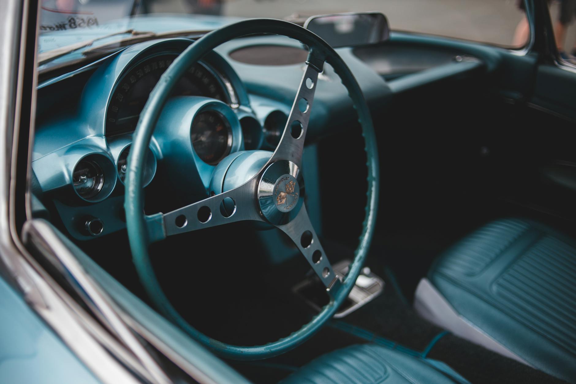 How to Restore Leather on a Steering Wheel: Expert Top Coat and Sealer Guide 3 Vintage classic car interior featuring a retro steering wheel and dashboard design.
